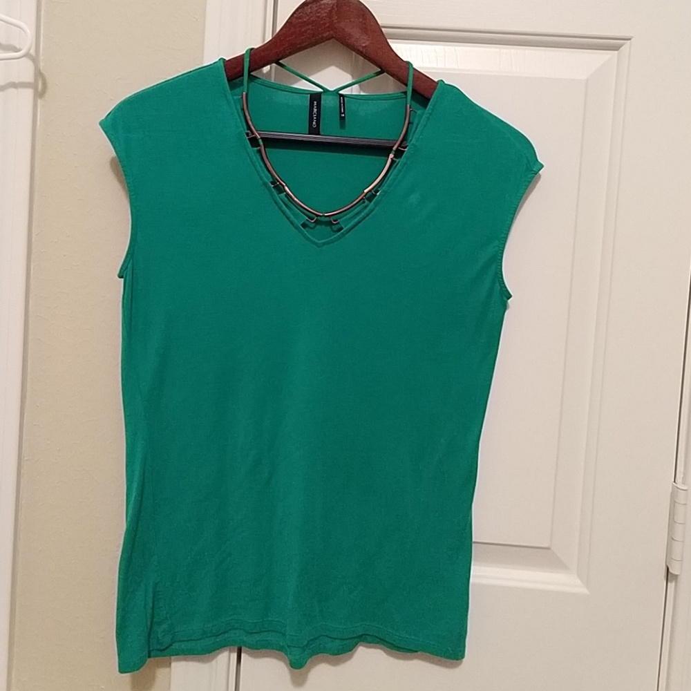 Marciano xs with gold trim around neck.